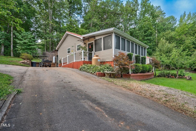 196 Red Wing Dr, Louisburg, NC 27549 - view of front of property with asphalt driveway and a sunroom