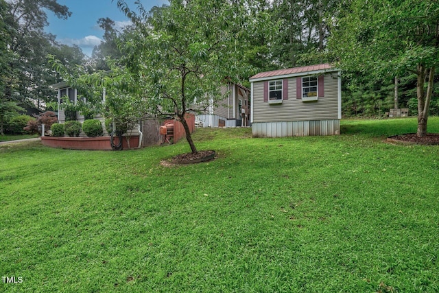 196 Red Wing Dr, Louisburg, NC 27549 - view of grassy yard with an outbuilding and view of scattered trees