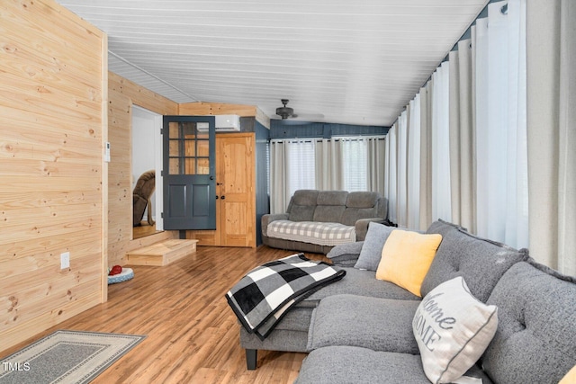 196 Red Wing Dr, Louisburg, NC 27549 - living area with wood finished floors, wooden walls, lofted ceiling, and ceiling fan