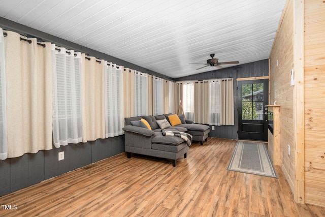 196 Red Wing Dr, Louisburg, NC 27549 - sunroom with wood finished floors, wooden walls, and lofted ceiling
