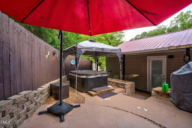 196 Red Wing Dr, Louisburg, NC 27549 - fenced backyard with a hot tub, a patio area, a grill, and a gazebo