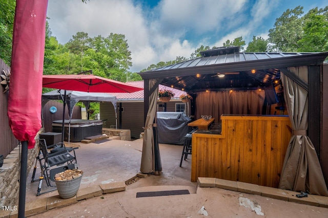 196 Red Wing Dr, Louisburg, NC 27549 - view of patio / terrace featuring a gazebo, a hot tub, and a bar