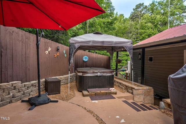 196 Red Wing Dr, Louisburg, NC 27549 - fenced backyard with a hot tub, a gazebo, and a patio