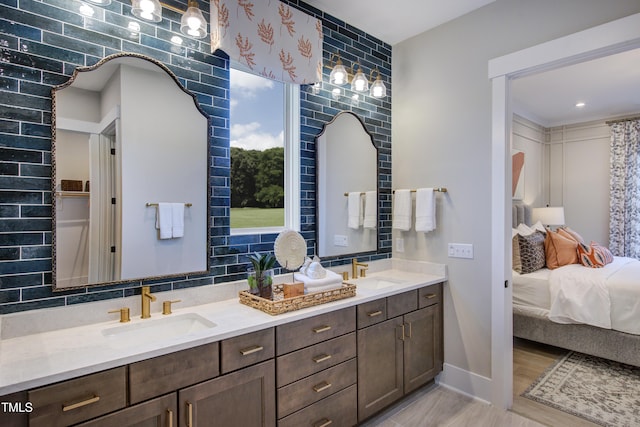 6104 Hope Farm Ln Unit 2, Wake Forest, NC 27587 - full bathroom featuring double vanity, connected bathroom, and wood finished floors