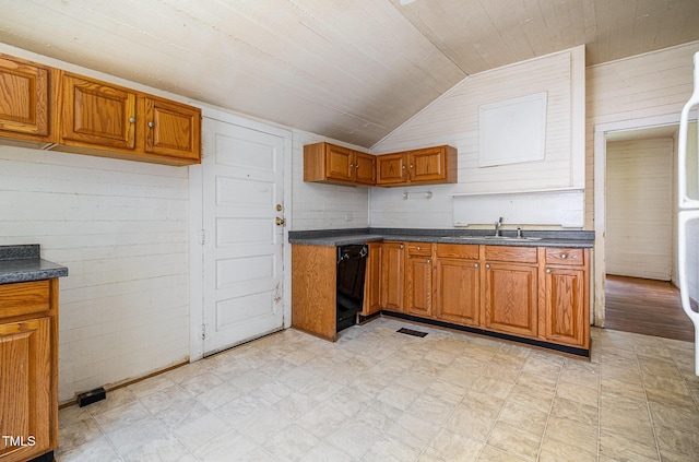 805 N Duke St, Durham, NC 27701 - kitchen featuring lofted ceiling, dark countertops, light flooring, brown cabinetry, and dishwasher