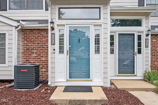 7771 Falcon Rest Cir, Raleigh, NC 27615 - doorway to property featuring brick siding
