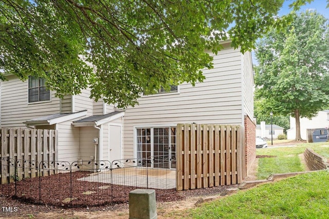 7771 Falcon Rest Cir, Raleigh, NC 27615 - rear view of house with a patio area