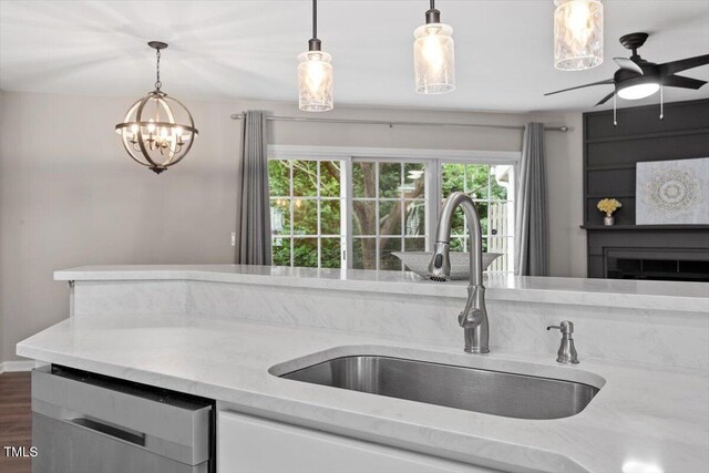 7771 Falcon Rest Cir, Raleigh, NC 27615 - kitchen featuring dishwasher, light stone countertops, and pendant lighting
