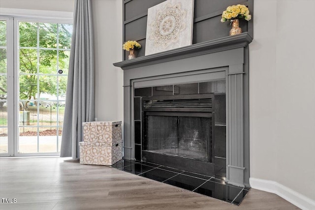 7771 Falcon Rest Cir, Raleigh, NC 27615 - detailed view of a tiled fireplace and wood finished floors