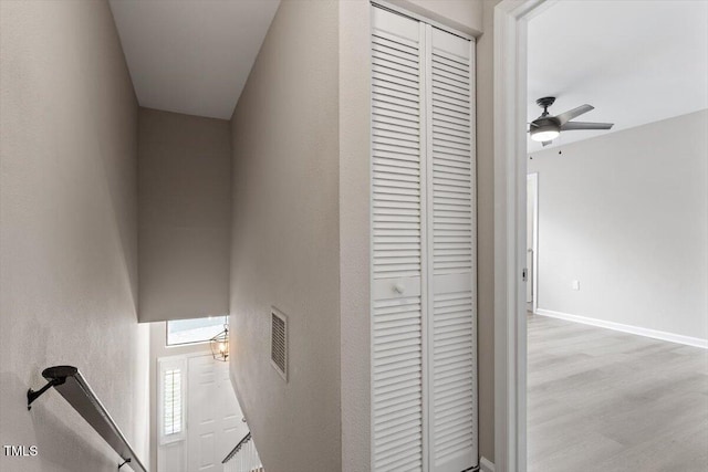 7771 Falcon Rest Cir, Raleigh, NC 27615 - corridor featuring wood finished floors and an upstairs landing
