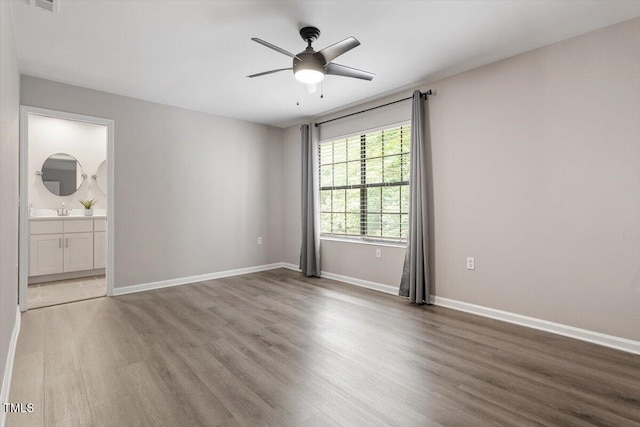 7771 Falcon Rest Cir, Raleigh, NC 27615 - empty room featuring wood finished floors and a ceiling fan