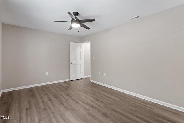 7771 Falcon Rest Cir, Raleigh, NC 27615 - unfurnished room featuring wood finished floors and a ceiling fan