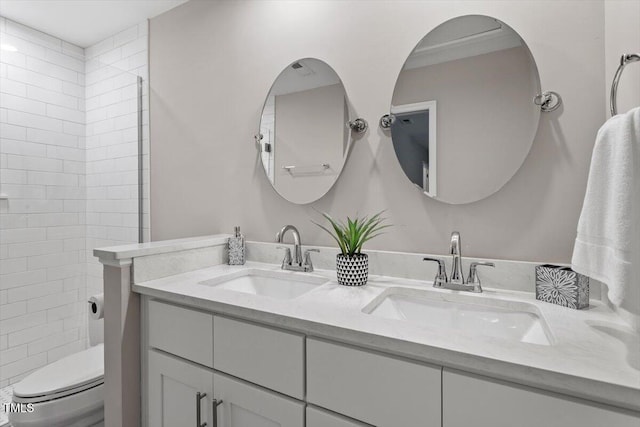 7771 Falcon Rest Cir, Raleigh, NC 27615 - bathroom featuring double vanity and toilet