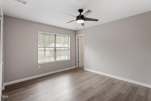 7771 Falcon Rest Cir, Raleigh, NC 27615 - empty room with wood finished floors and a ceiling fan