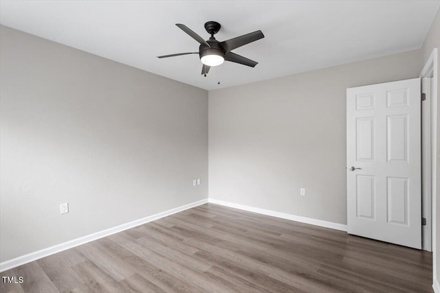 7771 Falcon Rest Cir, Raleigh, NC 27615 - unfurnished bedroom with wood finished floors and a ceiling fan