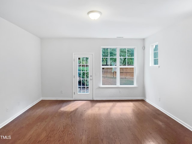 3010 Berkeley Springs Pl, Raleigh, NC 27616 - empty room with wood finished floors and healthy amount of natural light