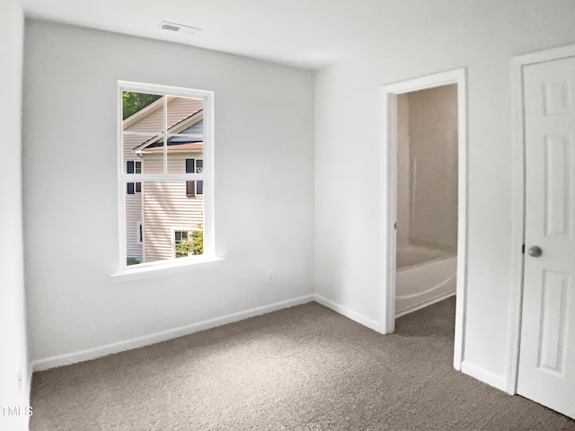 3010 Berkeley Springs Pl, Raleigh, NC 27616 - unfurnished bedroom with carpet and multiple windows