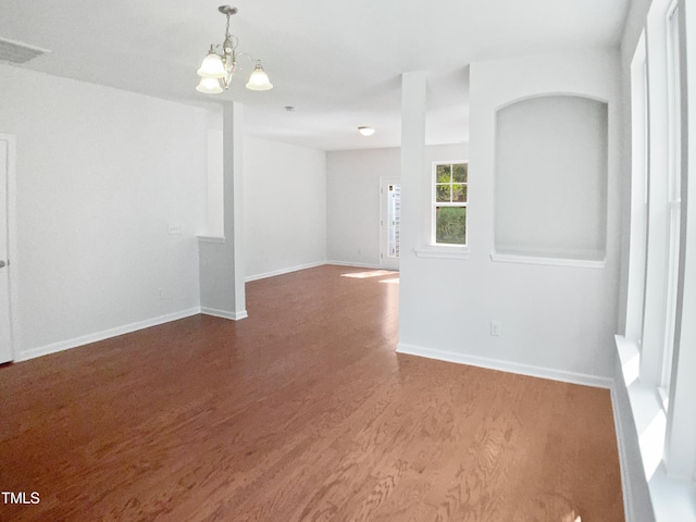 3010 Berkeley Springs Pl, Raleigh, NC 27616 - spare room with wood finished floors and a chandelier