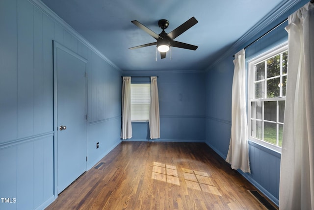 2510 Springhill Ave, Raleigh, NC 27603 - spare room with crown molding, wood finished floors, and a ceiling fan