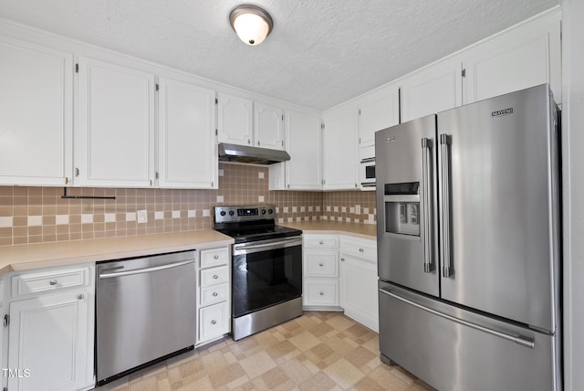 2510 Springhill Ave, Raleigh, NC 27603 - kitchen featuring stainless steel appliances, light flooring, light countertops, white cabinets, and a textured ceiling