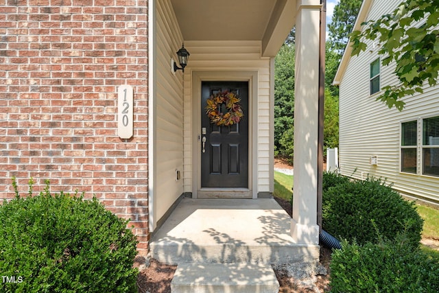 120 Holly Berry Ln, Durham, NC 27703 - property entrance with brick siding and covered porch
