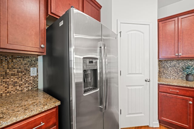 120 Holly Berry Ln, Durham, NC 27703 - kitchen with stainless steel fridge, decorative backsplash, and light stone counters