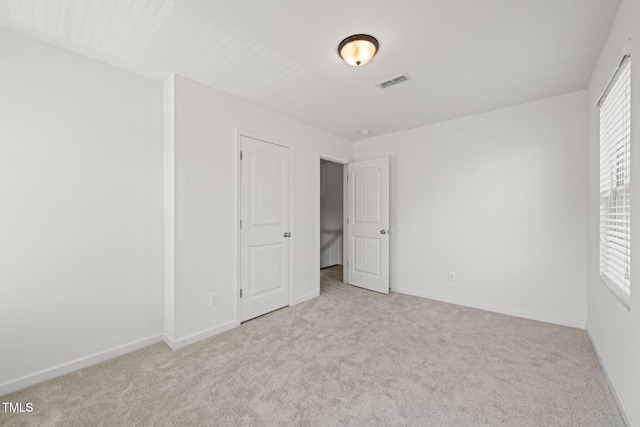 120 Holly Berry Ln, Durham, NC 27703 - unfurnished bedroom with carpet floors and baseboards