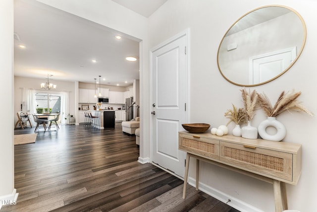 3019 Newfields Pl, Durham, NC 27703 - corridor with dark wood finished floors, recessed lighting, and a chandelier