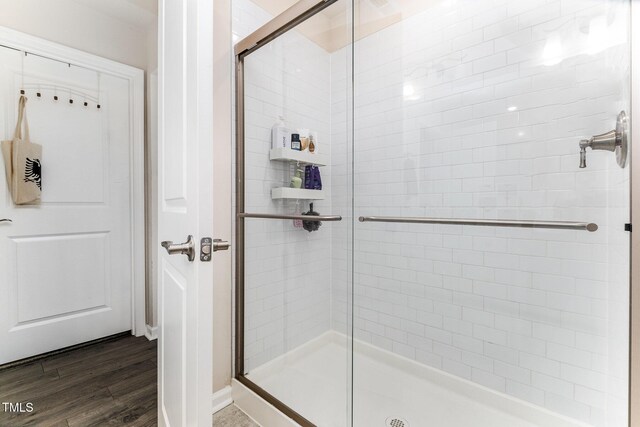 3019 Newfields Pl, Durham, NC 27703 - full bath with a stall shower and wood finished floors