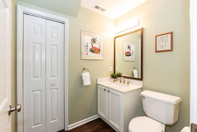 10 Biltmore Pl, Durham, NC 27712 - half bathroom with a closet, vanity, and wood finished floors