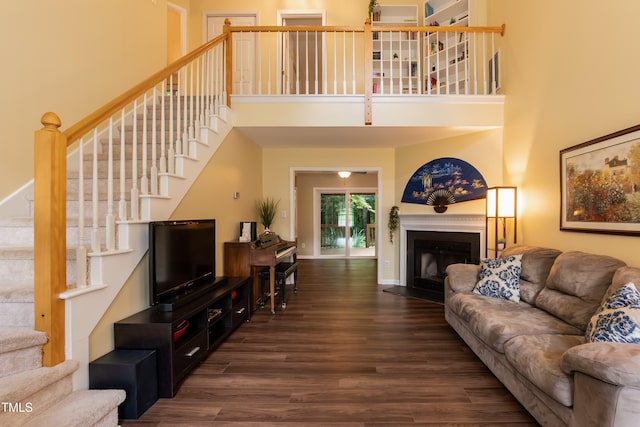 10 Biltmore Pl, Durham, NC 27712 - living room with a towering ceiling, wood finished floors, stairs, and a fireplace with flush hearth