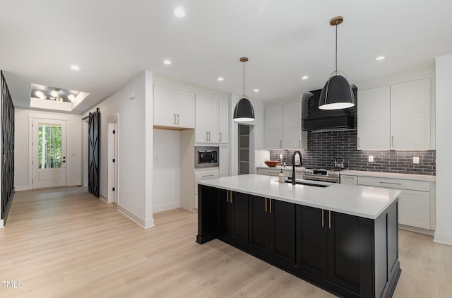 3714 Ode Turner Rd, Hillsborough, NC 27278 - kitchen featuring backsplash, wall chimney exhaust hood, white cabinets, light wood-style flooring, and recessed lighting
