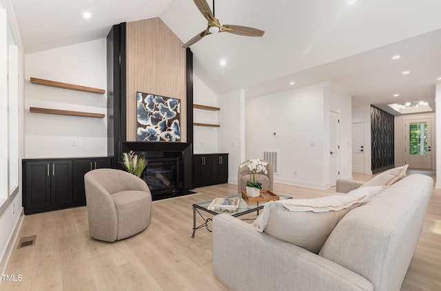 3714 Ode Turner Rd, Hillsborough, NC 27278 - living room featuring a glass covered fireplace, high vaulted ceiling, light wood finished floors, a ceiling fan, and recessed lighting