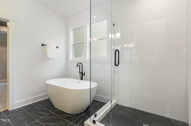 3714 Ode Turner Rd, Hillsborough, NC 27278 - full bathroom featuring marble look tile flooring, a shower stall, and a soaking tub