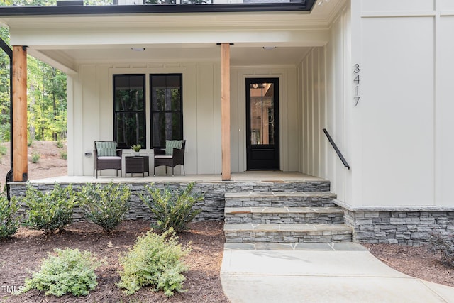 3714 Ode Turner Rd, Hillsborough, NC 27278 - view of exterior entry featuring covered porch and board and batten siding