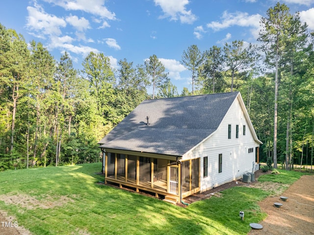 3714 Ode Turner Rd, Hillsborough, NC 27278 - rear view of property with a sunroom, a shingled roof, a lawn, and a forest view