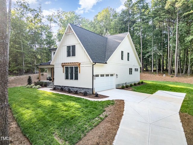 3714 Ode Turner Rd, Hillsborough, NC 27278 - view of front of property featuring roof with shingles, concrete driveway, board and batten siding, and a front yard