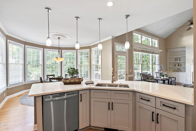 100 Beraneak Ln, Cary, NC 27519 - kitchen with stainless steel dishwasher, light stone counters, hanging light fixtures, light wood-style floors, and ornamental molding