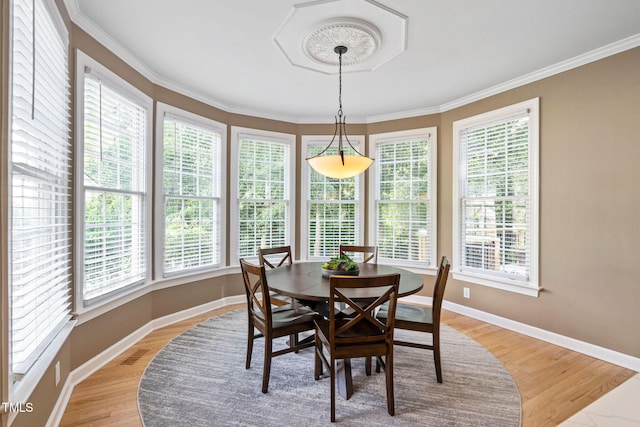 100 Beraneak Ln, Cary, NC 27519 - dining area with light wood finished floors, healthy amount of natural light, and ornamental molding