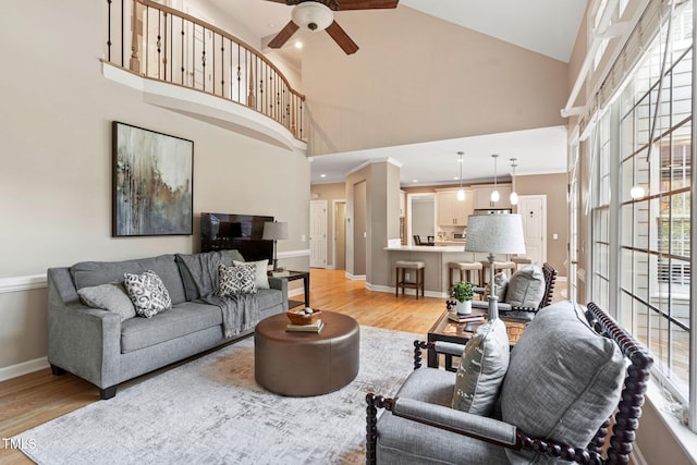 100 Beraneak Ln, Cary, NC 27519 - living area featuring light wood-style floors, ceiling fan, high vaulted ceiling, and recessed lighting