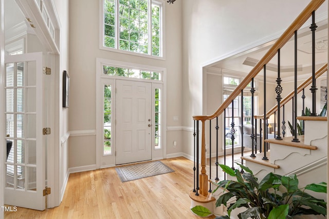 100 Beraneak Ln, Cary, NC 27519 - entrance foyer with healthy amount of natural light, stairway, a high ceiling, and wood finished floors