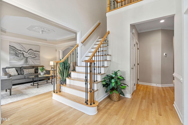 100 Beraneak Ln, Cary, NC 27519 - stairway with wood finished floors, ornamental molding, and recessed lighting