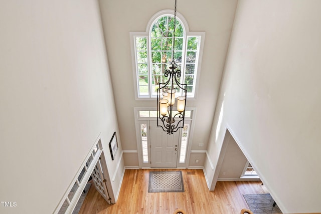 100 Beraneak Ln, Cary, NC 27519 - entrance foyer with a high ceiling, healthy amount of natural light, a chandelier, and light wood-type flooring