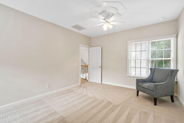 100 Beraneak Ln, Cary, NC 27519 - living area featuring light carpet, a ceiling fan, and an upstairs landing