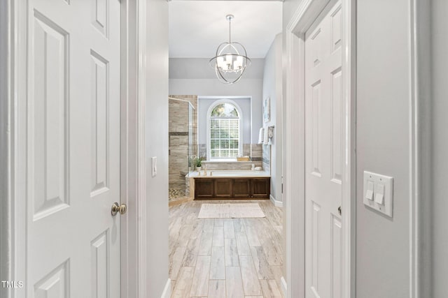 100 Beraneak Ln, Cary, NC 27519 - bathroom featuring a shower stall, wood finished floors, a chandelier, and vanity