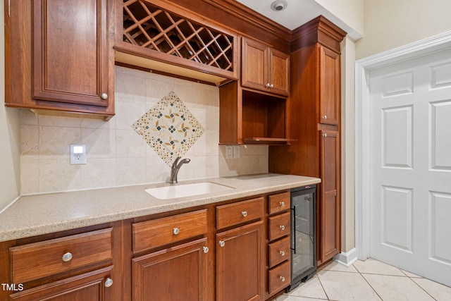 100 Beraneak Ln, Cary, NC 27519 - kitchen featuring wine cooler, tasteful backsplash, brown cabinets, and light tile patterned floors