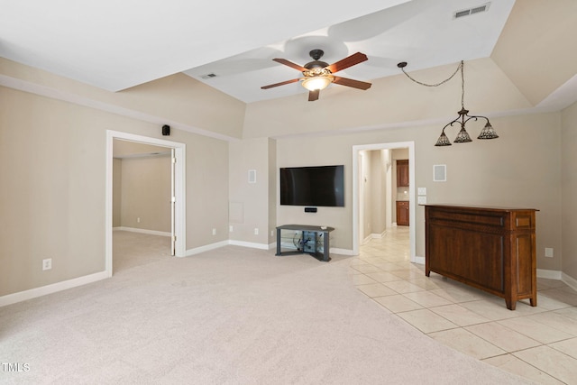100 Beraneak Ln, Cary, NC 27519 - unfurnished living room with a ceiling fan, light tile patterned flooring, light colored carpet, and vaulted ceiling