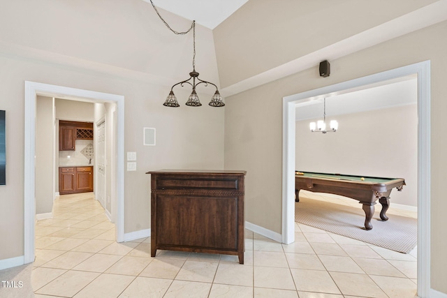100 Beraneak Ln, Cary, NC 27519 - dining room with a chandelier, light tile patterned flooring, pool table, and vaulted ceiling