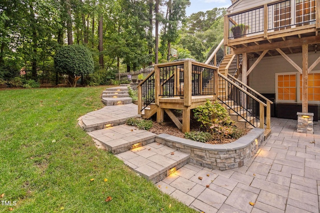 100 Beraneak Ln, Cary, NC 27519 - view of green lawn with stairs, a patio, a wooden deck, and view of wooded area