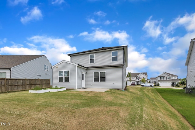 2307 Bethpage Dr, Fuquay Varina, NC 27526 - rear view of house featuring a patio and a residential view
